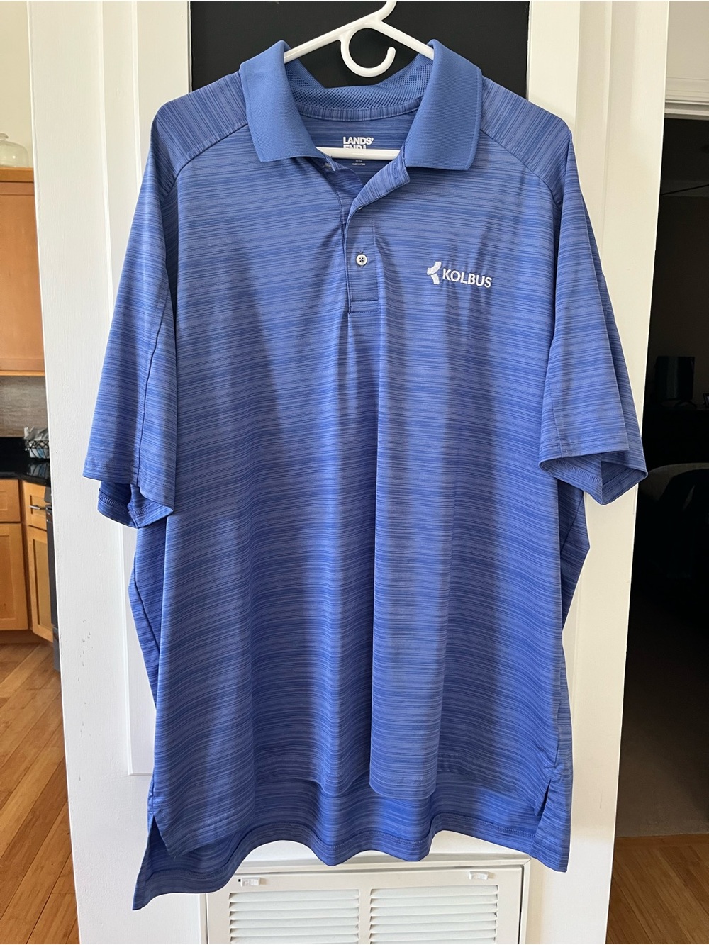 4 polo shirts. 1 Under Armour and 3 Lands End. 3 2x and 1 1x sized